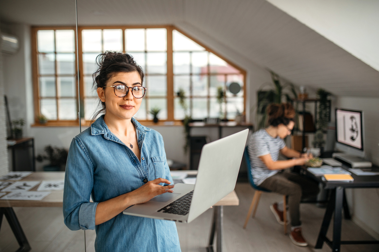 oung office worker woman with laptop